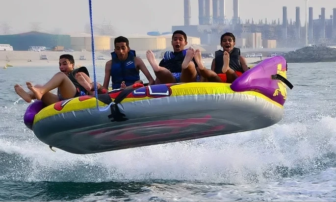 Group of people enjoying a sofa boat ride during a water adventure in Dubai